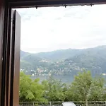 Between Mountains And Carate Urio